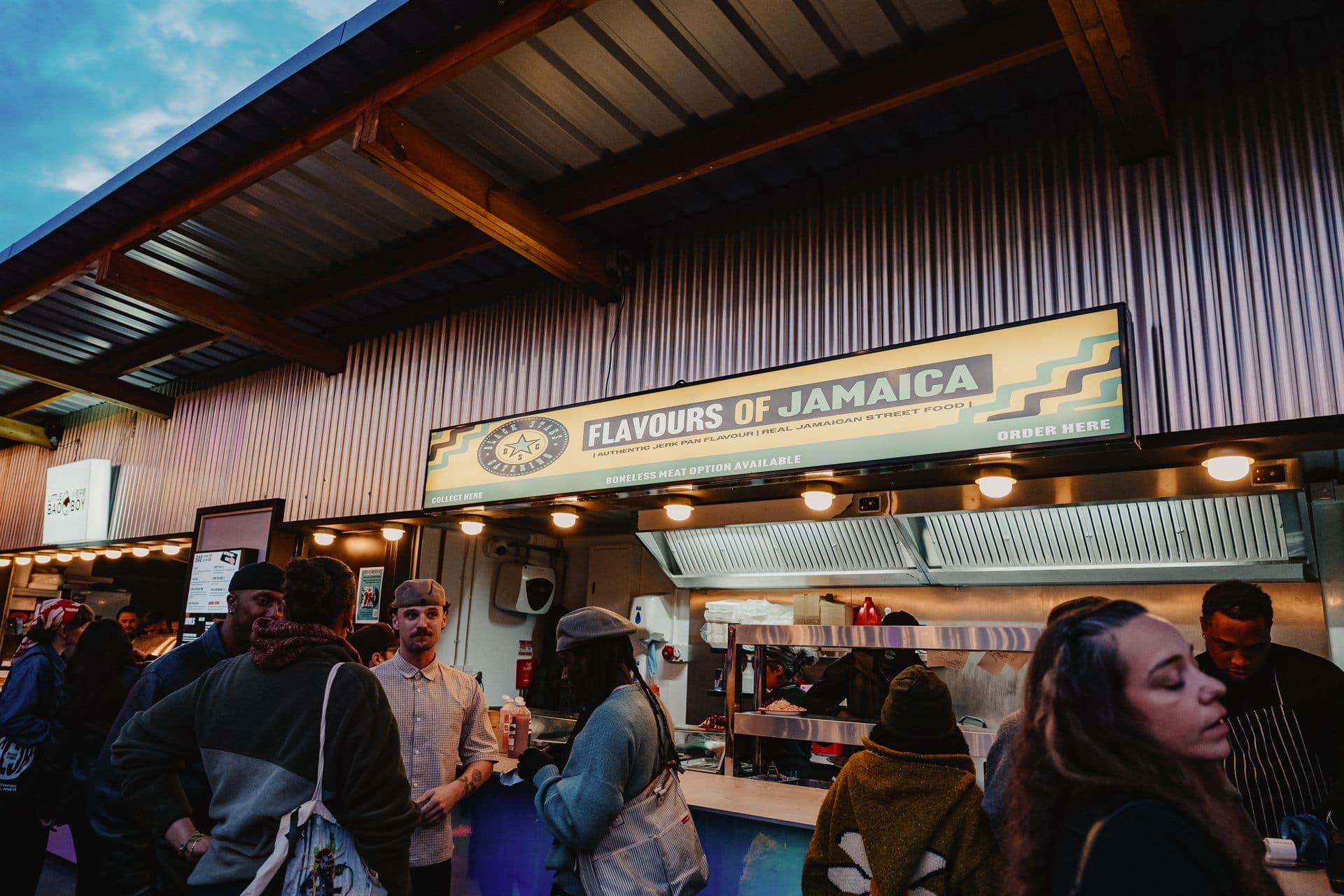 Guests queuing at one of Freight Brixton's street food traders